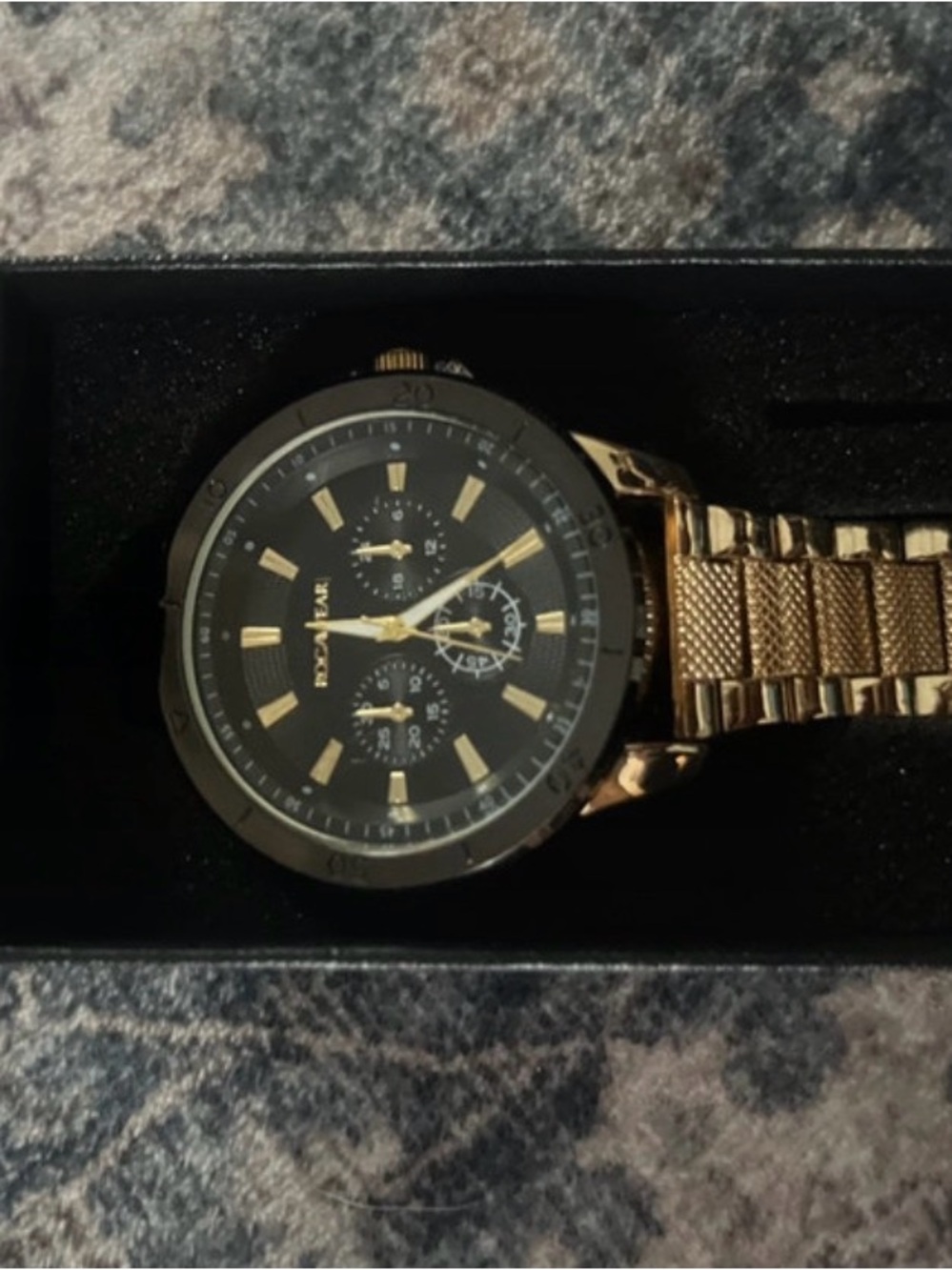 a Rocawear men's gold-tone and black chronograph-style wrist watch